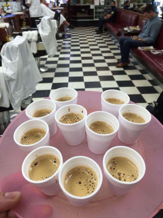 Ten urban coffees put on top of the plate inside the barbershop